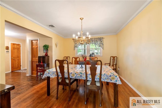 14 Devon Rd, Edison, NJ 08820 - dining space with a chandelier, ornamental molding, and wood finished floors