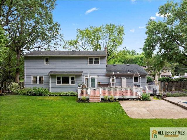 14 Devon Rd, Edison, NJ 08820 - back of property with a wooden deck, a patio area, and a chimney