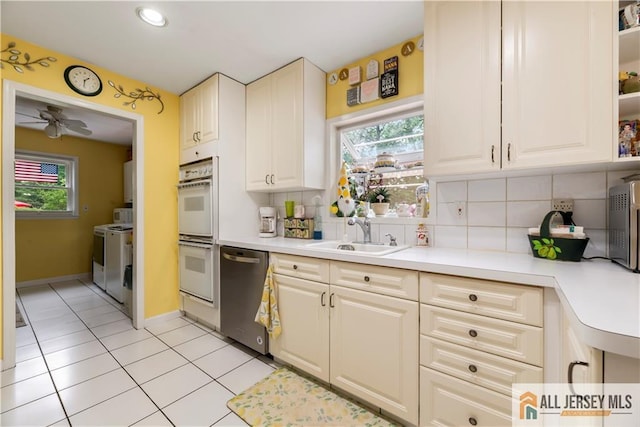 14 Devon Rd, Edison, NJ 08820 - kitchen with dishwasher, white double oven, plenty of natural light, decorative backsplash, and recessed lighting