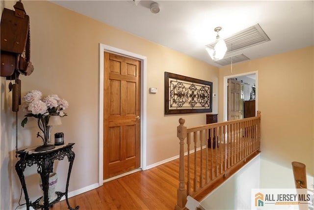 14 Devon Rd, Edison, NJ 08820 - hall with attic access, an upstairs landing, and light wood-style floors