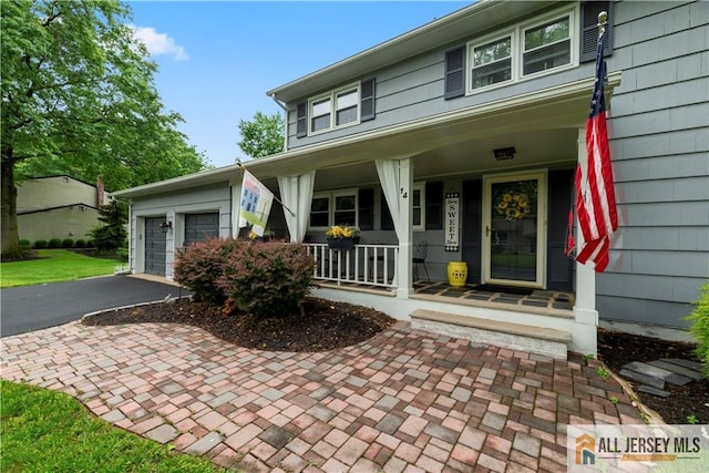 14 Devon Rd, Edison, NJ 08820 - view of front of home featuring a porch and driveway