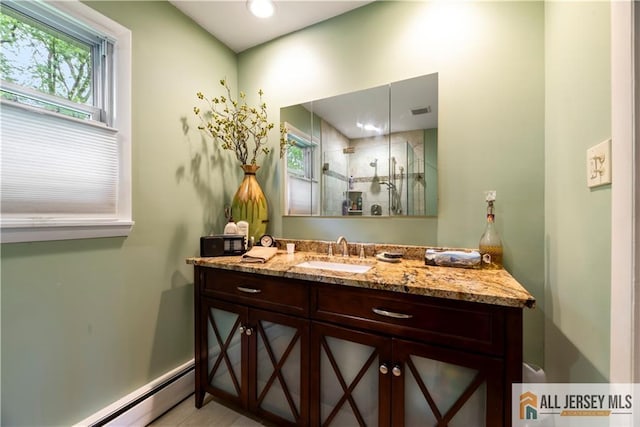 14 Devon Rd, Edison, NJ 08820 - full bath featuring a baseboard heating unit, vanity, and a shower stall