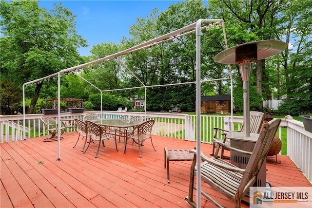 14 Devon Rd, Edison, NJ 08820 - wooden terrace with outdoor dining area and view of wooded area