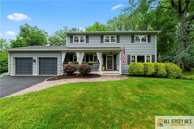 14 Devon Rd, Edison, NJ 08820 - view of front of property featuring covered porch, driveway, an attached garage, and a front lawn