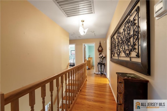 14 Devon Rd, Edison, NJ 08820 - hallway with an upstairs landing and light wood-style flooring