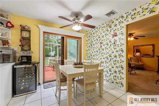 14 Devon Rd, Edison, NJ 08820 - dining room with wallpapered walls, beverage cooler, a ceiling fan, an accent wall, and light tile patterned floors