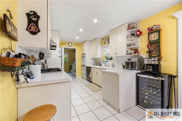 14 Devon Rd, Edison, NJ 08820 - kitchen featuring wine cooler, exhaust hood, light countertops, dishwashing machine, and recessed lighting