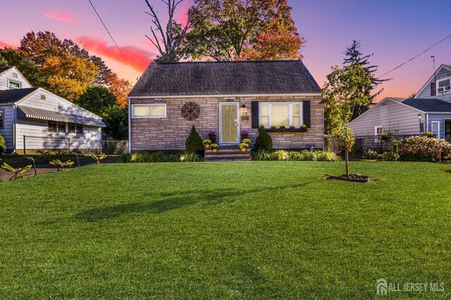 view of front of home with a lawn