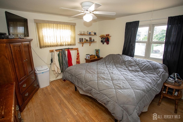 22 Woodcrest Dr, Old Bridge, NJ 08857 - bedroom with light wood-type flooring and a ceiling fan