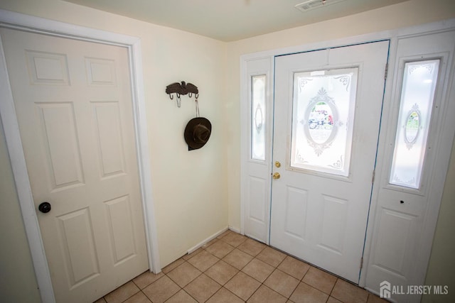 22 Woodcrest Dr, Old Bridge, NJ 08857 - entryway with plenty of natural light and light tile patterned floors