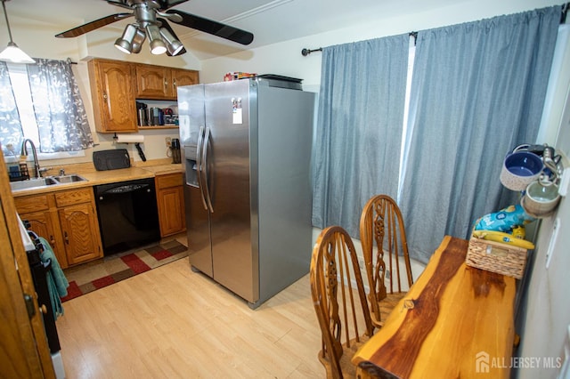22 Woodcrest Dr, Old Bridge, NJ 08857 - kitchen featuring stainless steel refrigerator with ice dispenser, black dishwasher, a ceiling fan, light wood-style floors, and brown cabinetry