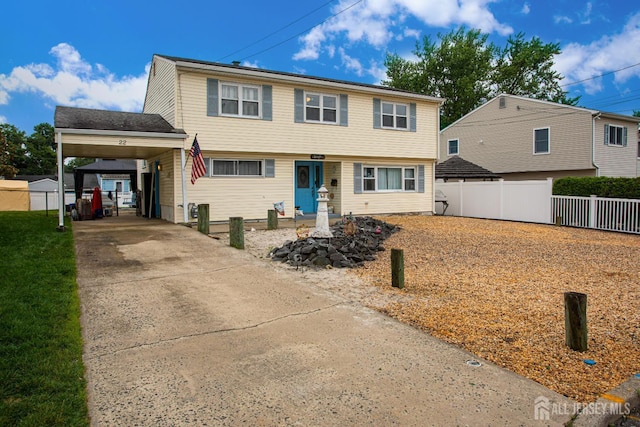 22 Woodcrest Dr, Old Bridge, NJ 08857 - colonial-style house with driveway and a carport