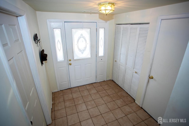 22 Woodcrest Dr, Old Bridge, NJ 08857 - entryway featuring light tile patterned floors
