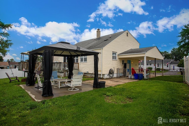 22 Woodcrest Dr, Old Bridge, NJ 08857 - rear view of property featuring a gazebo, a patio area, and a chimney