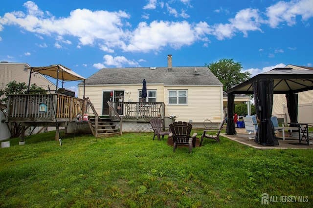 22 Woodcrest Dr, Old Bridge, NJ 08857 - rear view of property featuring a gazebo, a lawn, a deck, and a patio area