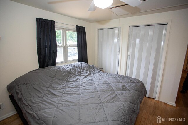 22 Woodcrest Dr, Old Bridge, NJ 08857 - bedroom featuring wood finished floors, attic access, a ceiling fan, and multiple closets