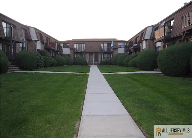 view of community featuring a yard