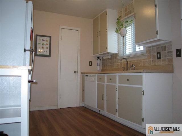 kitchen with wood finished floors, light countertops, white cabinets, tasteful backsplash, and dishwasher