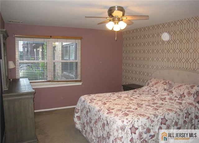 bedroom with baseboards, carpet, and ceiling fan