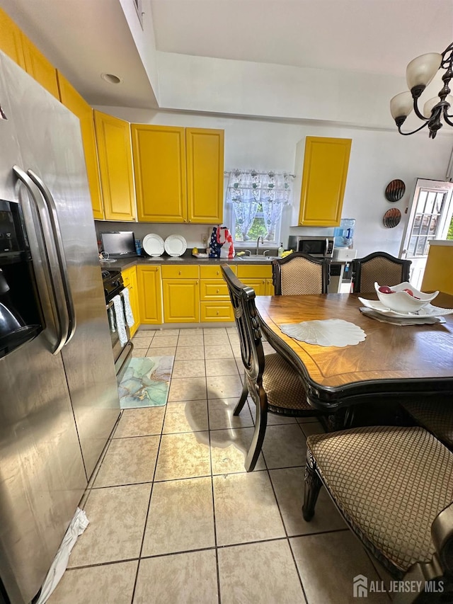 428 Broadhead Pl, Perth Amboy, NJ 08861 - kitchen with appliances with stainless steel finishes, a sink, light tile patterned floors, and dark countertops
