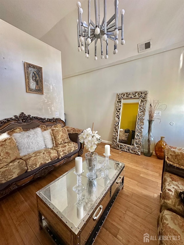 428 Broadhead Pl, Perth Amboy, NJ 08861 - living room with a chandelier and hardwood / wood-style flooring