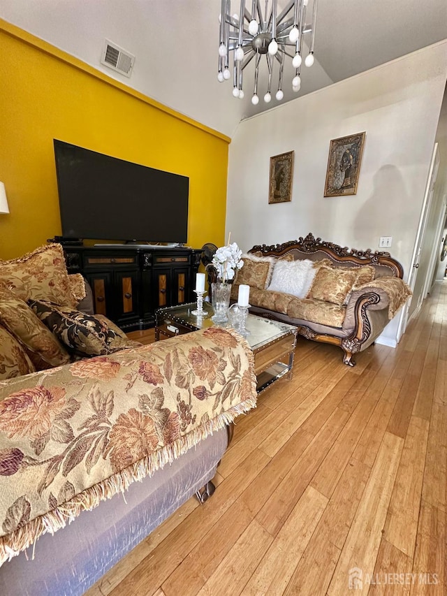 428 Broadhead Pl, Perth Amboy, NJ 08861 - living area with wood-type flooring and a chandelier