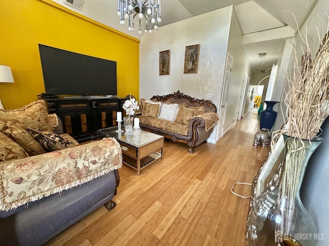 428 Broadhead Pl, Perth Amboy, NJ 08861 - living area featuring hardwood / wood-style floors, a chandelier, and baseboards