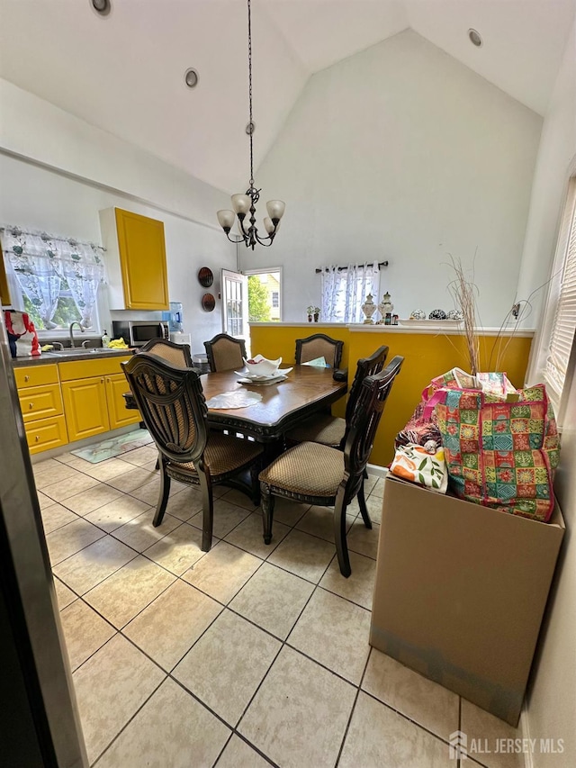 428 Broadhead Pl, Perth Amboy, NJ 08861 - dining space featuring a chandelier, light tile patterned floors, high vaulted ceiling, and recessed lighting