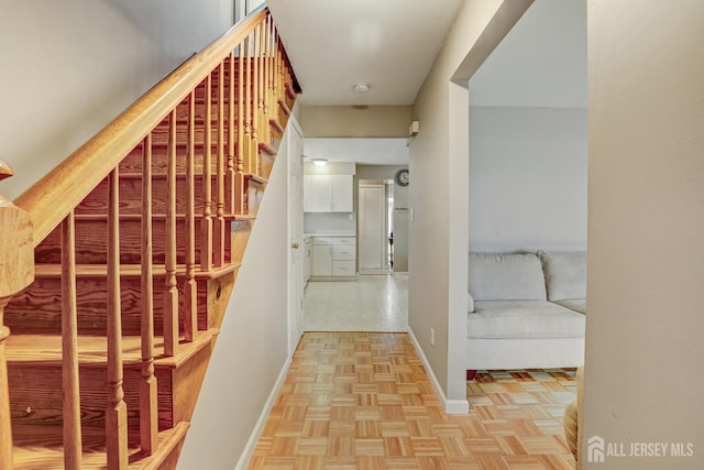 staircase with parquet flooring