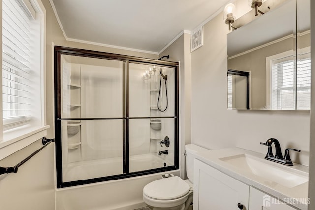 full bathroom with shower / bath combination with glass door, vanity, ornamental molding, and toilet