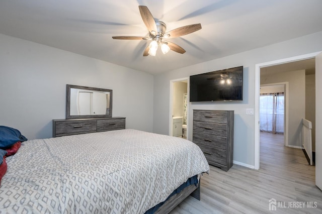 bedroom with light wood finished floors, ceiling fan, and baseboards