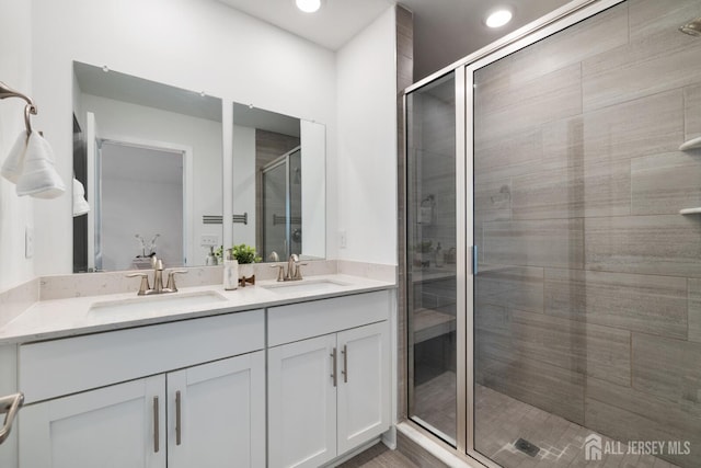 1617 Swales Ct, Monroe, NJ 08831 - full bath featuring double vanity, a shower stall, and recessed lighting