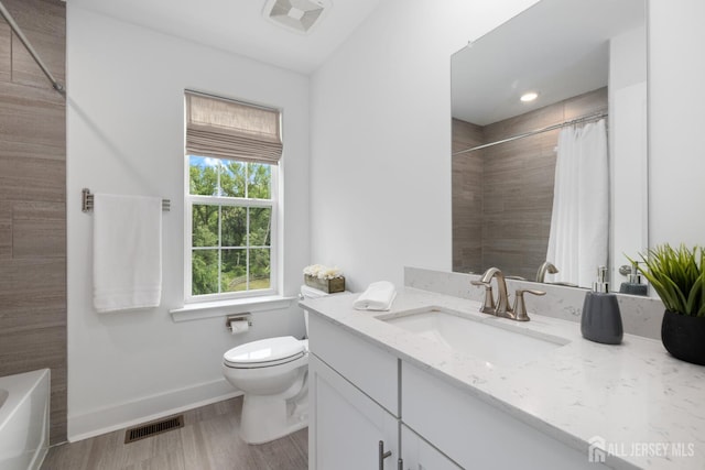 1617 Swales Ct, Monroe, NJ 08831 - bathroom featuring vanity, toilet, baseboards, and wood finished floors