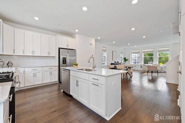 1617 Swales Ct, Monroe, NJ 08831 - kitchen featuring appliances with stainless steel finishes, a sink, light countertops, white cabinetry, and recessed lighting