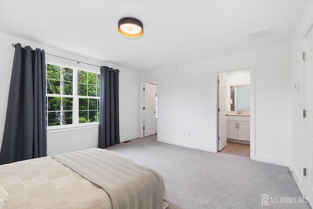 1617 Swales Ct, Monroe, NJ 08831 - bedroom with light carpet, baseboards, and ensuite bath