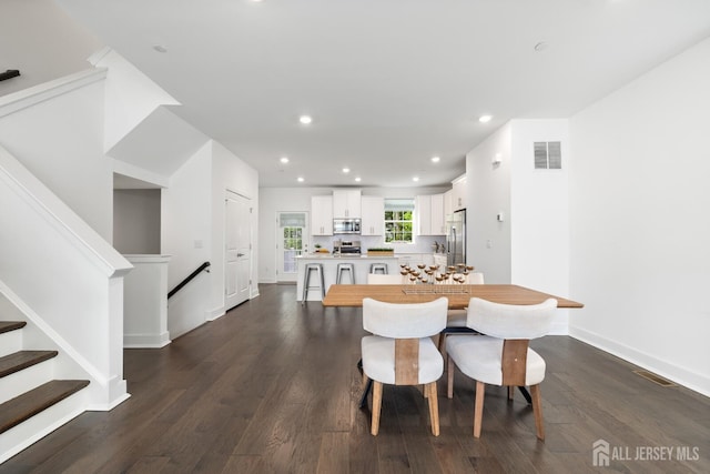 1617 Swales Ct, Monroe, NJ 08831 - dining area featuring dark wood-style floors, recessed lighting, stairway, and baseboards