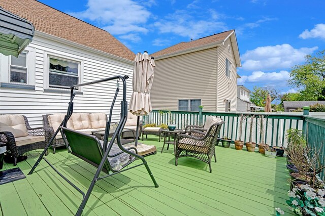 deck featuring outdoor lounge area