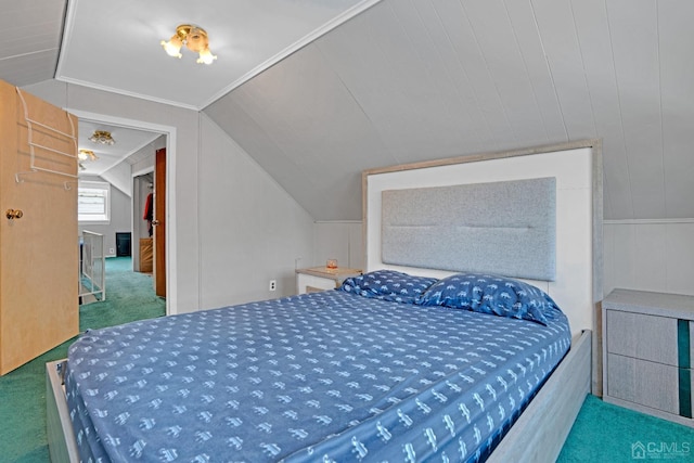 bedroom featuring lofted ceiling, carpet floors, and ornamental molding