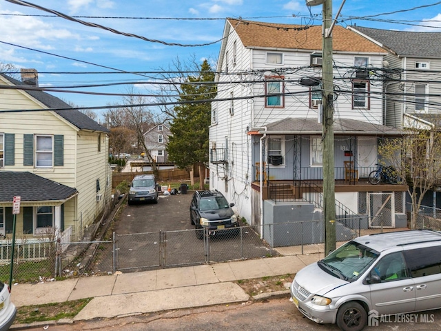 184 Seaman St, New Brunswick, NJ 08901 - view of front of house featuring a gate, a fenced front yard, and a residential view