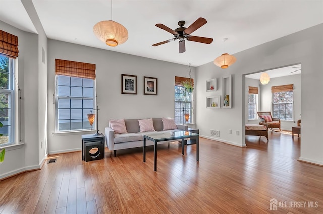 57 Cortland Dr N, East Brunswick, NJ 08816 - living room with plenty of natural light, visible vents, and wood finished floors