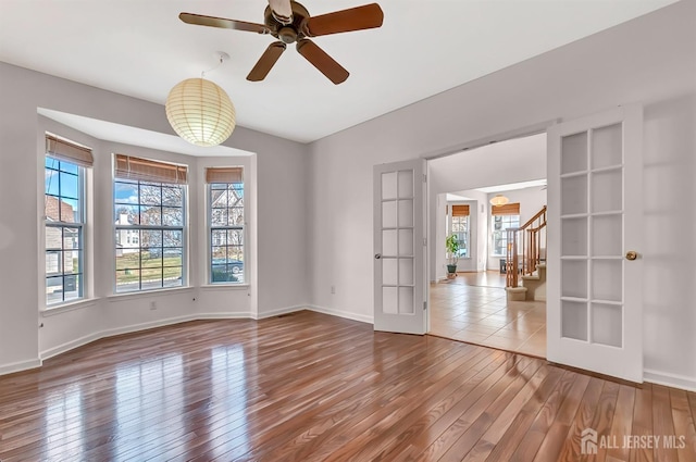 57 Cortland Dr N, East Brunswick, NJ 08816 - unfurnished room with stairs, plenty of natural light, and wood finished floors