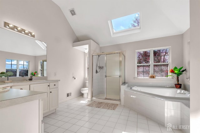 57 Cortland Dr N, East Brunswick, NJ 08816 - bathroom with toilet, vaulted ceiling with skylight, visible vents, tile patterned flooring, and a shower stall
