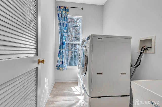 57 Cortland Dr N, East Brunswick, NJ 08816 - laundry room with washer and clothes dryer, a sink, laundry area, stone finish floor, and baseboards