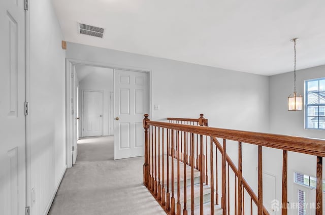 57 Cortland Dr N, East Brunswick, NJ 08816 - hall with visible vents, an upstairs landing, and light carpet