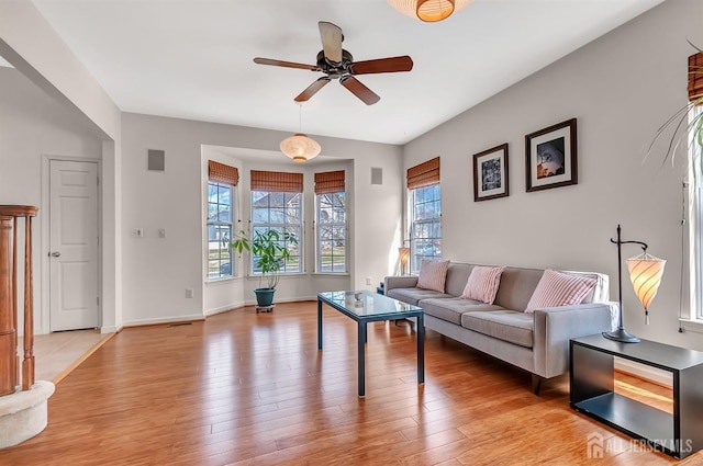 57 Cortland Dr N, East Brunswick, NJ 08816 - living room with ceiling fan, baseboards, and light wood finished floors