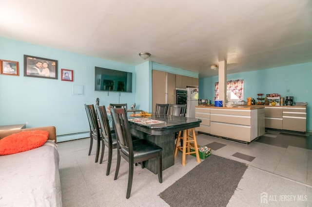 185 Redmond St, New Brunswick, NJ 08901 - dining area featuring light flooring and a baseboard radiator