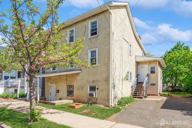 185 Redmond St, New Brunswick, NJ 08901 - view of property with stucco siding and cooling unit