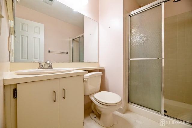 125 Albury Way N, Brunswick, NJ 08902 - full bath with a stall shower, toilet, vanity, and tile patterned flooring
