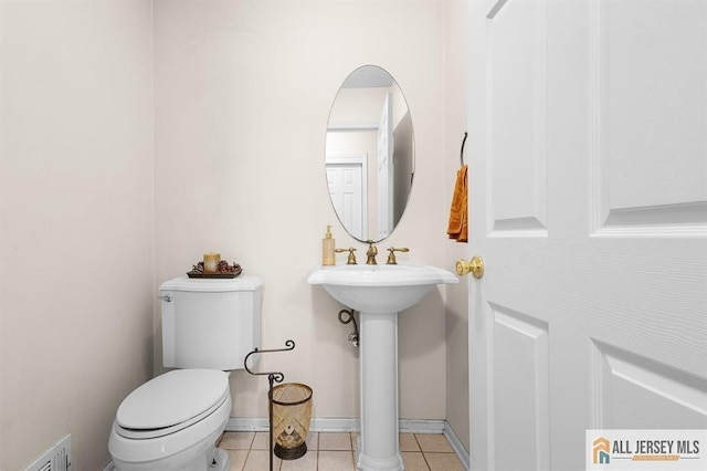 3 Eric Ct, Monroe, NJ 08831 - half bathroom featuring toilet and tile patterned flooring