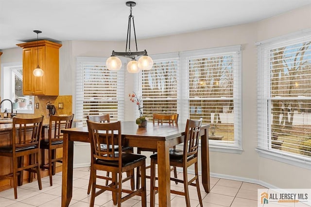 3 Eric Ct, Monroe, NJ 08831 - dining area with light tile patterned flooring, a chandelier, and baseboards